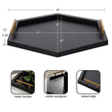 Black hexagonal wooden tray with visible woodgrain and gold metal handles, featuring a raised edge and dimensions marked around it
