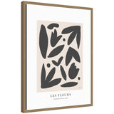 Exposition d Art Les Fleurs framed canvas wall art print styled on a white wall above vintage chair with a woven seat