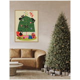 Framed retro-style illustration of black cats playing on a green Christmas tree with colorful ornaments and wrapped presents below, hanging on a beige wall above a brown sofa.