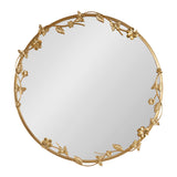 Round wall mirror with a gold metal frame detailed with floral, leaf, and butterfly accents arranged asymmetrically around the edge.