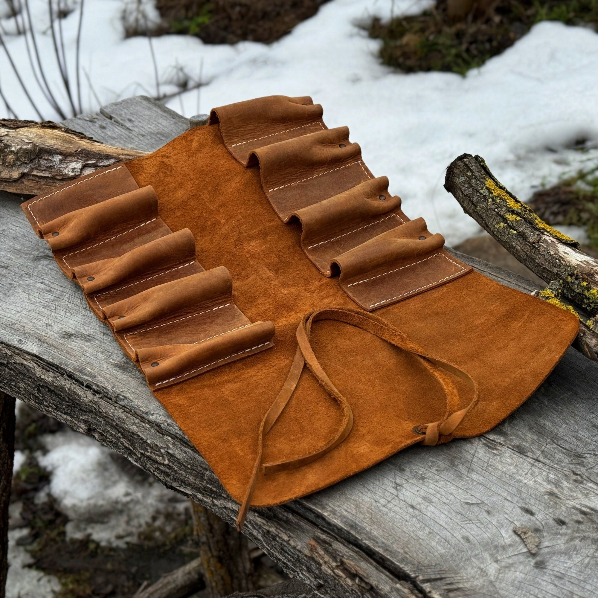Handmade 8 pocket leather tool roll by Sharky Forged Steel Tools, open with tools inside