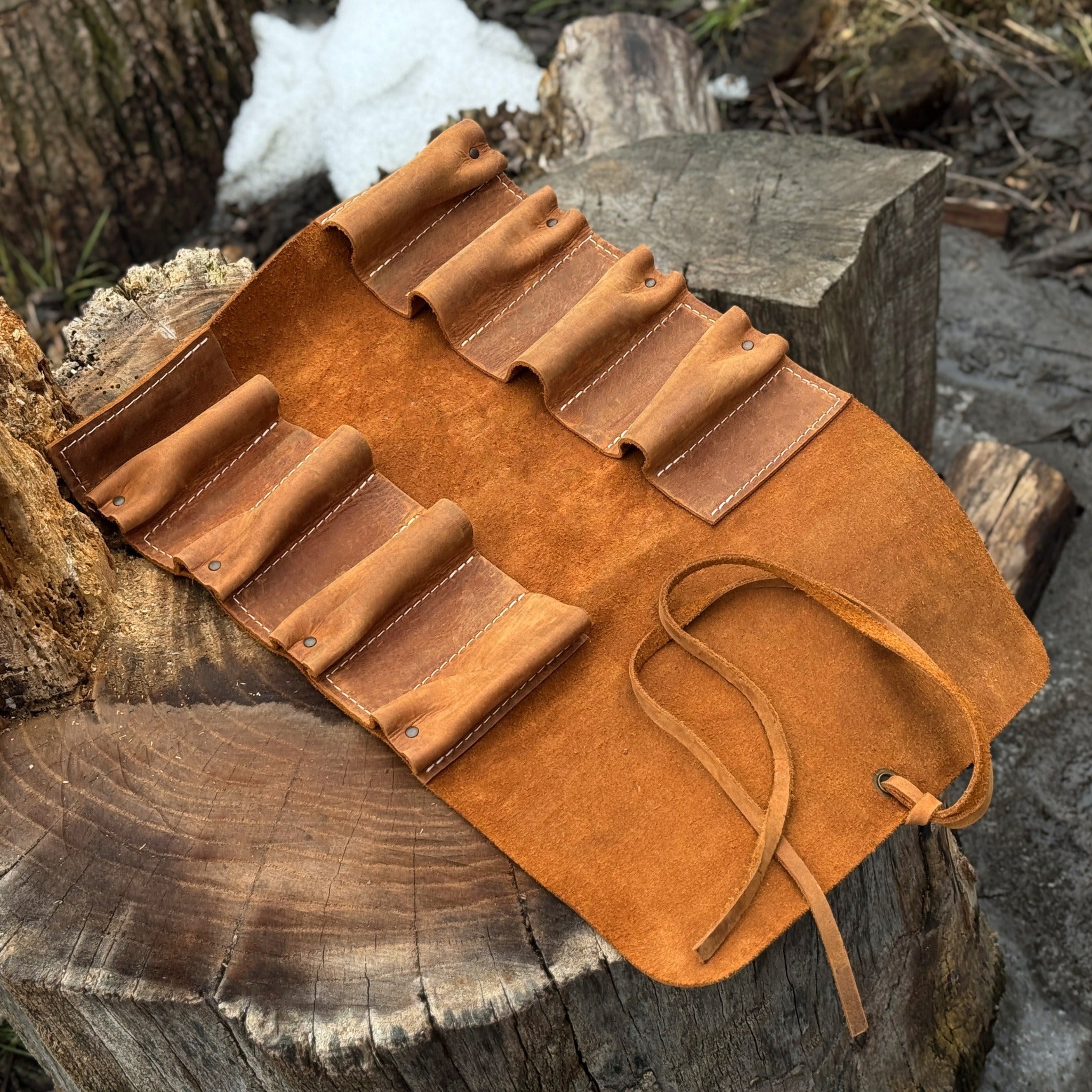 Handmade 8 pocket leather tool roll by Sharky Forged Steel Tools, open with tools inside