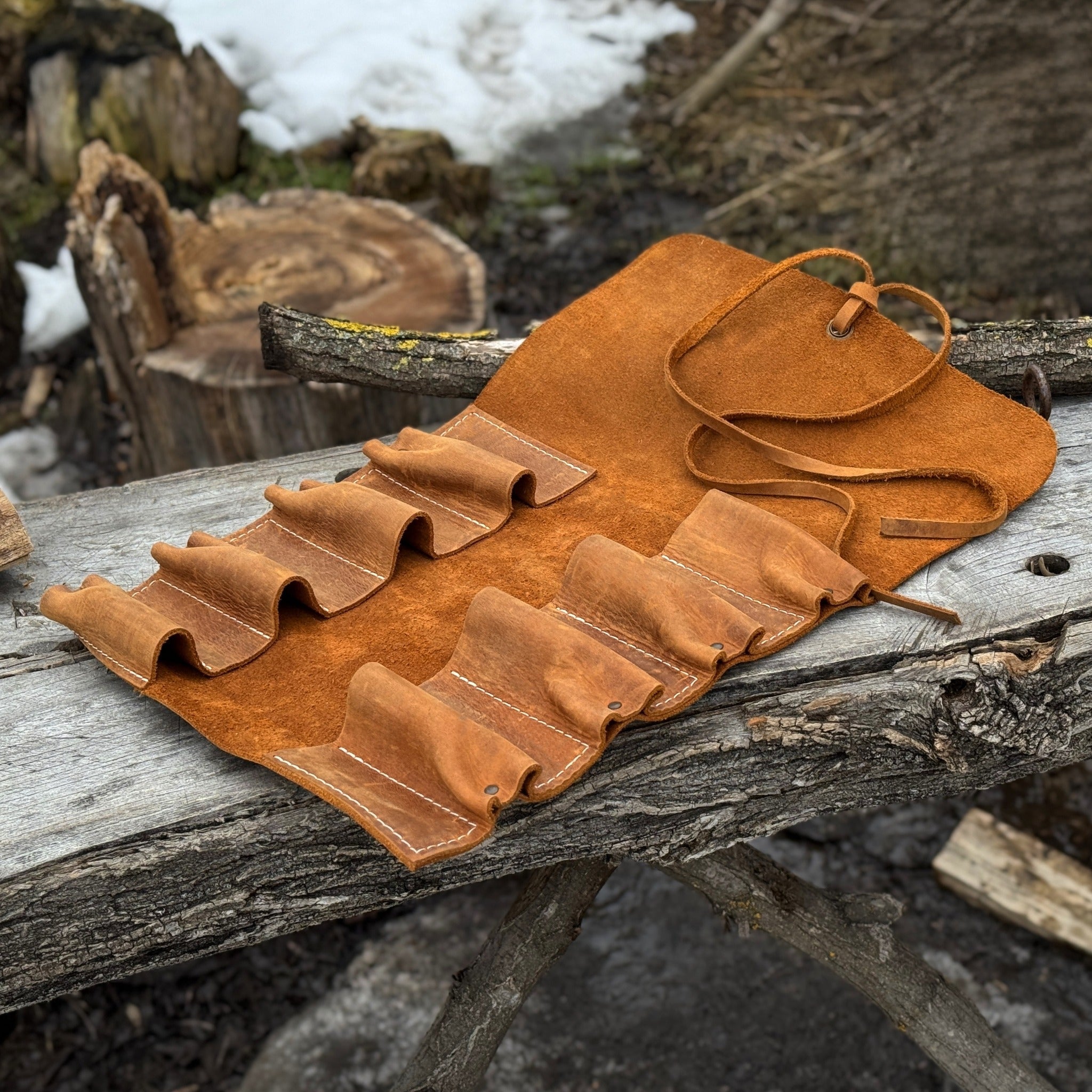 Handmade 8 pocket leather tool roll by Sharky Forged Steel Tools, open with tools inside