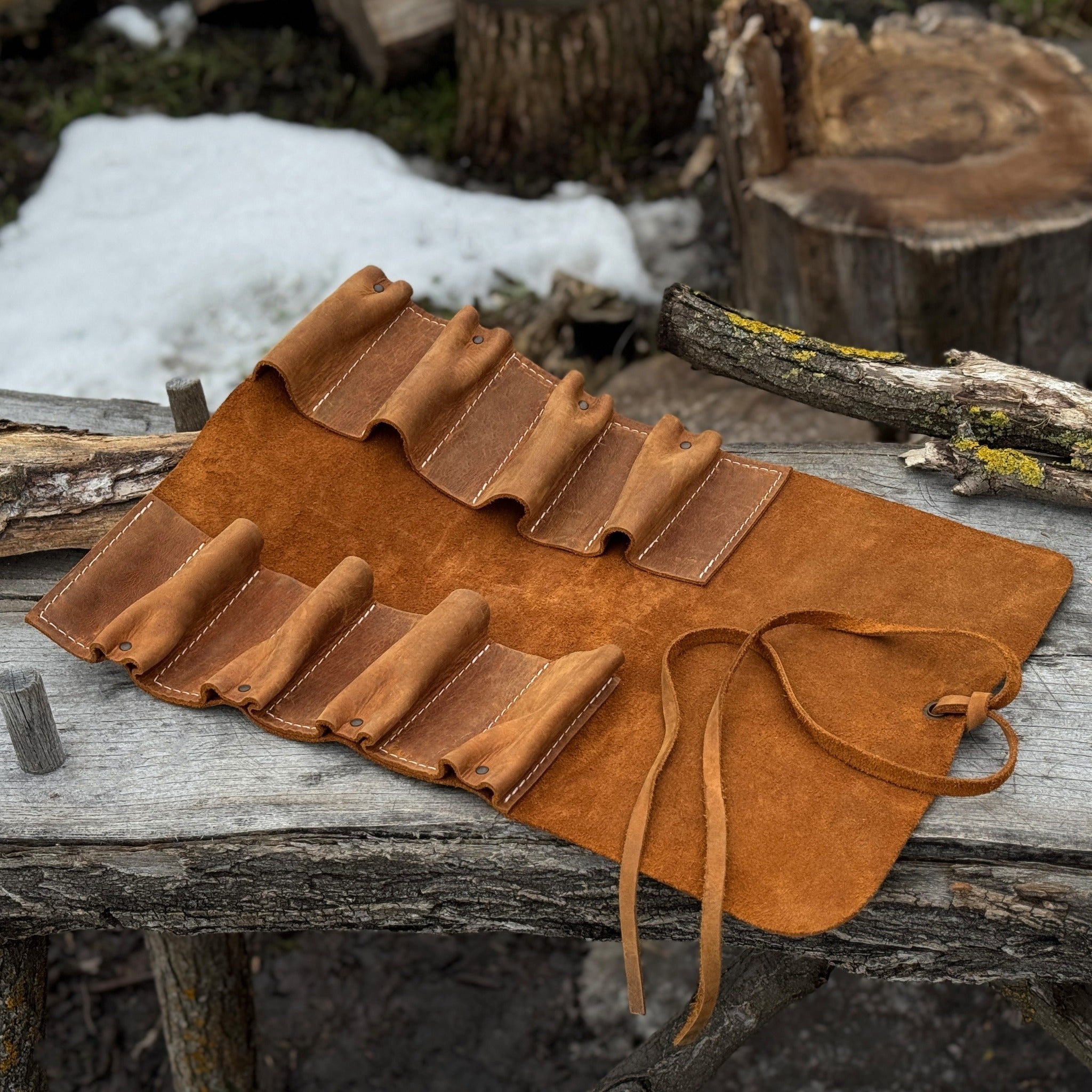 Handmade 8 pocket leather tool roll by Sharky Forged Steel Tools, open with tools inside
