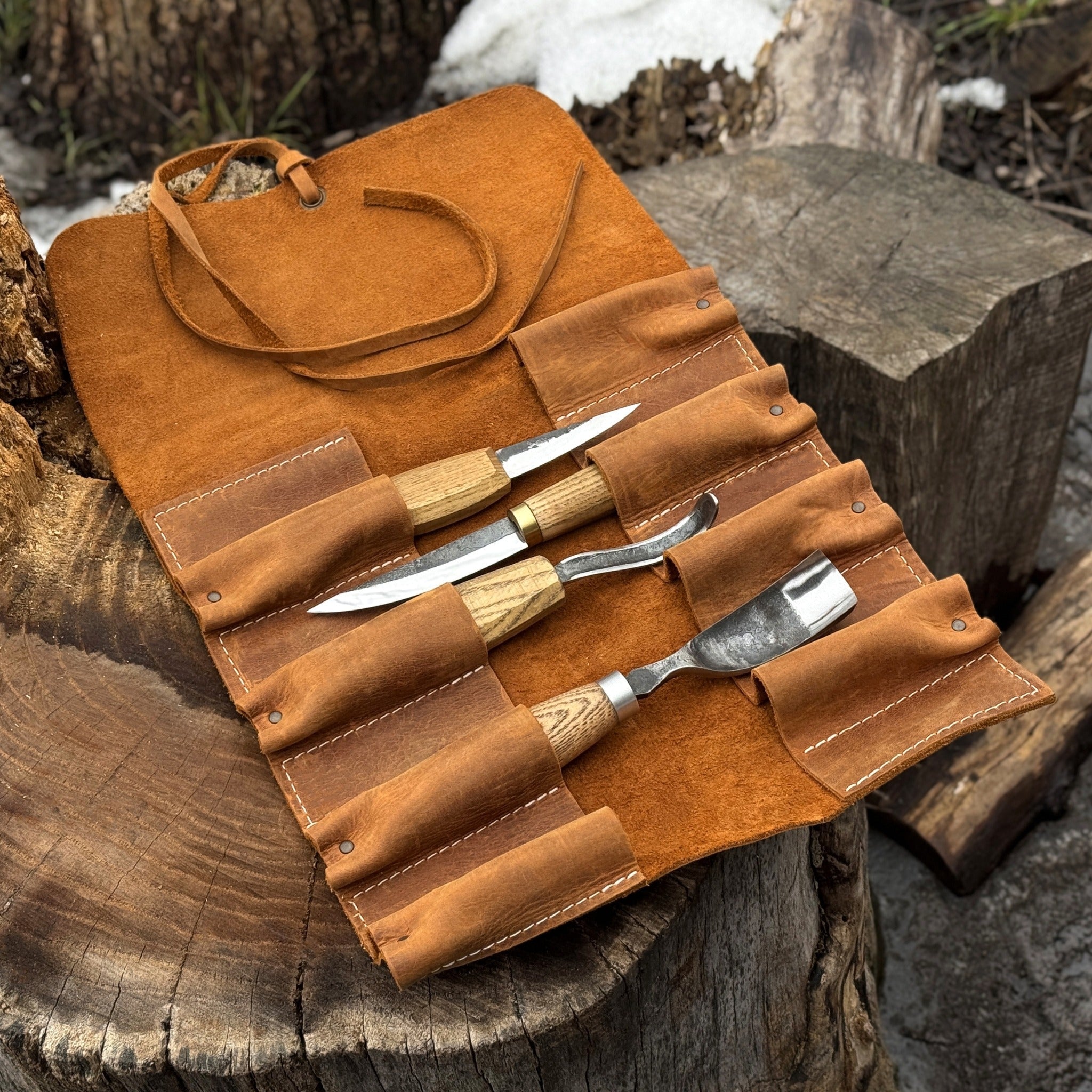 Handmade 8 pocket leather tool roll by Sharky Forged Steel Tools, open with tools inside
