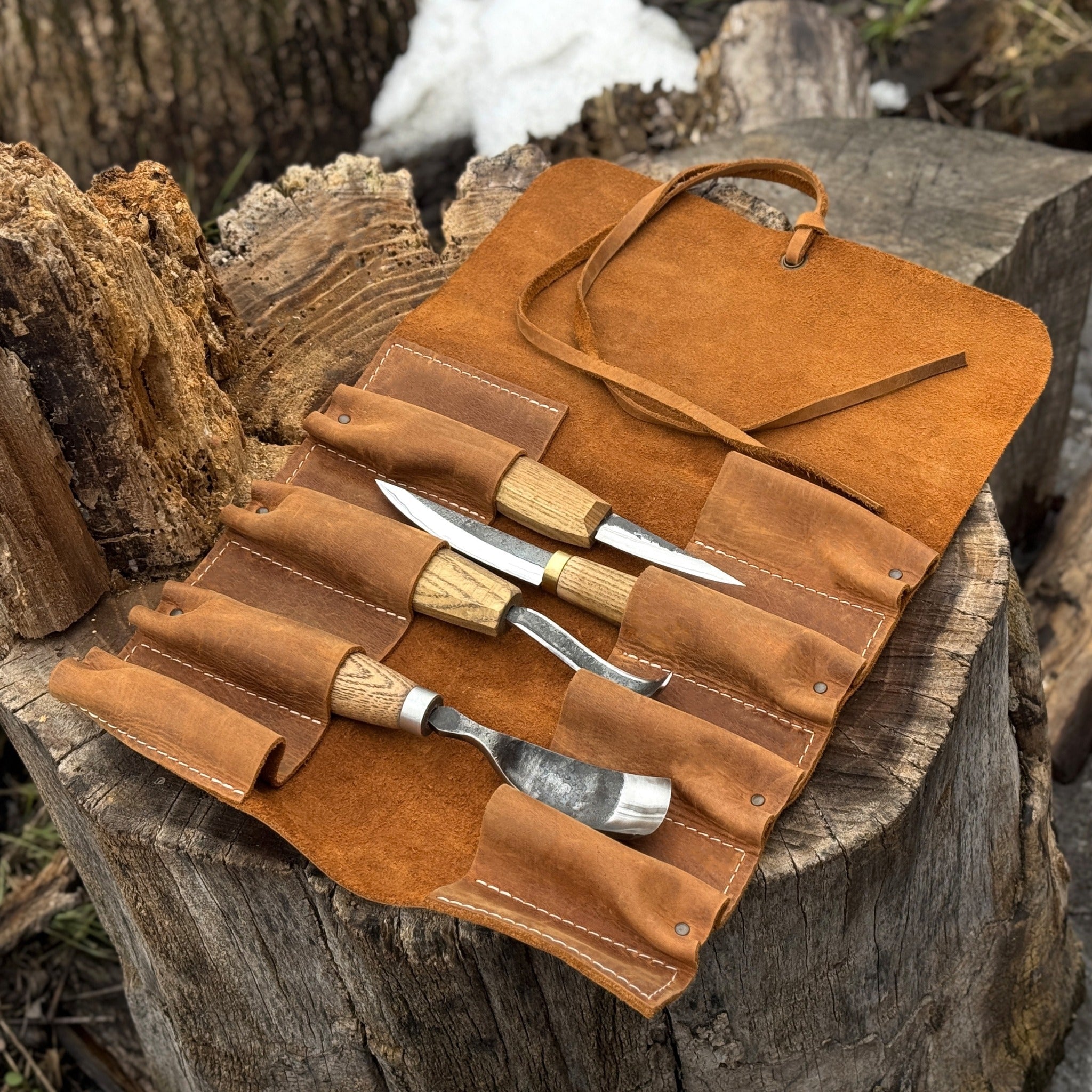 Handmade 8 pocket leather tool roll by Sharky Forged Steel Tools, open with tools inside