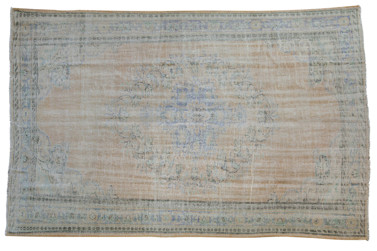 6x9.5 Vintage Distressed Oushak Carpet displaying floral medallions in beige, pale blue, apricot, and antique ivory