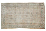 5.5x9 Vintage Distressed Oushak Carpet with repeating starburst floral lattice design in pastel and muted tones