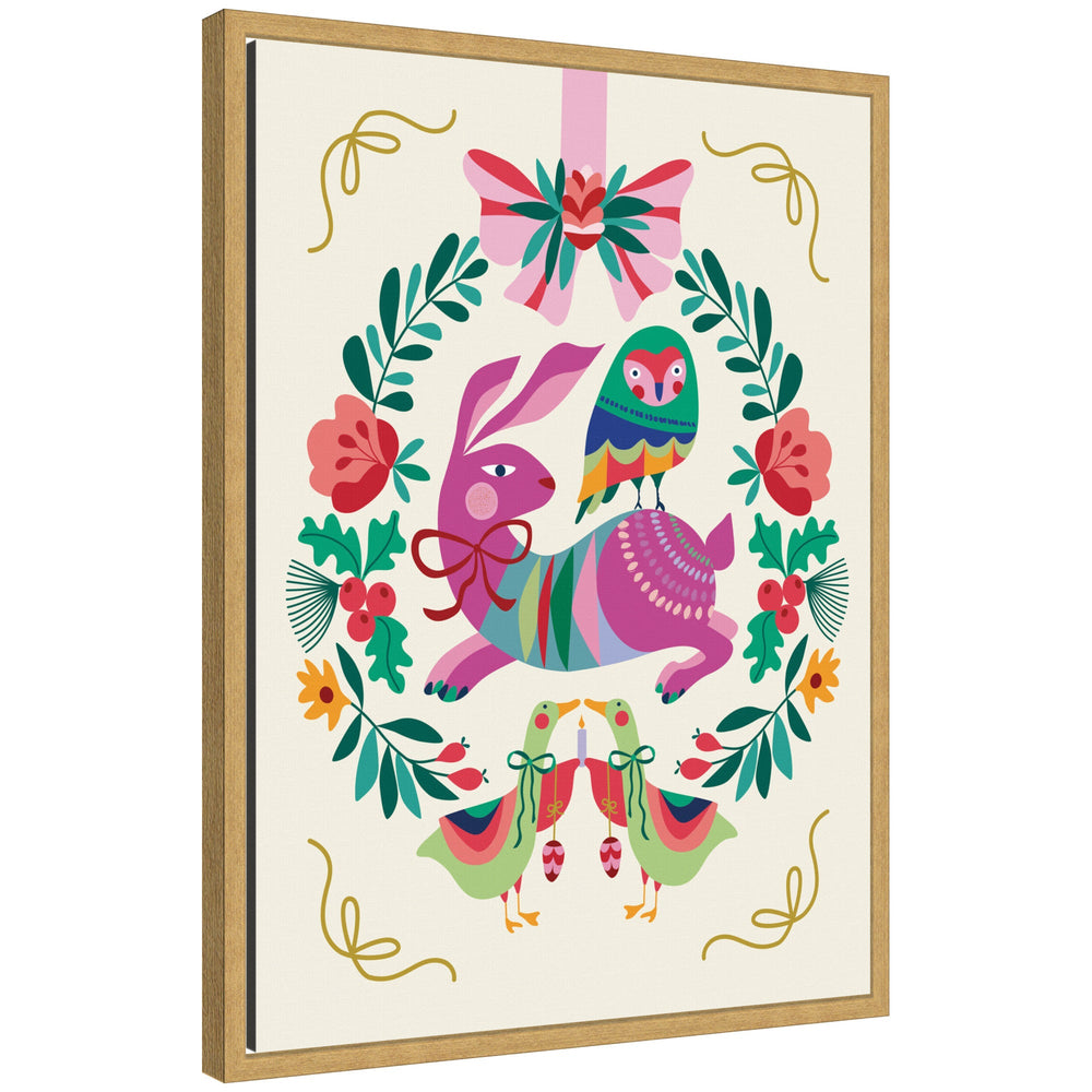 Framed canvas art of woodland animals Christmas wreath showing rabbit with bow, multicolored bird on its back, surrounded by leaves and flowers with birds holding candles