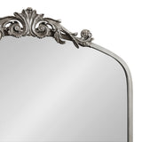 Top portion of Arendahl Traditional Arch Mirror with a silver ornate scrollwork design on an arch-shaped frame.