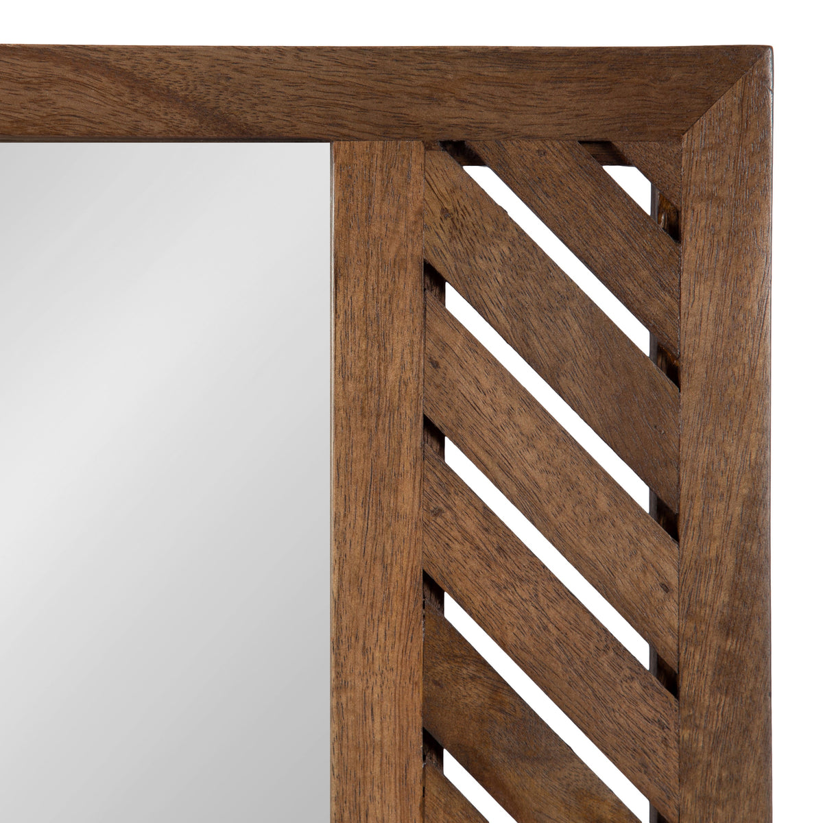 Close-up of a wooden wall mirror frame with a geometric diagonal slat pattern on the right side and smooth wood on the top edge, showing warm brown tones.