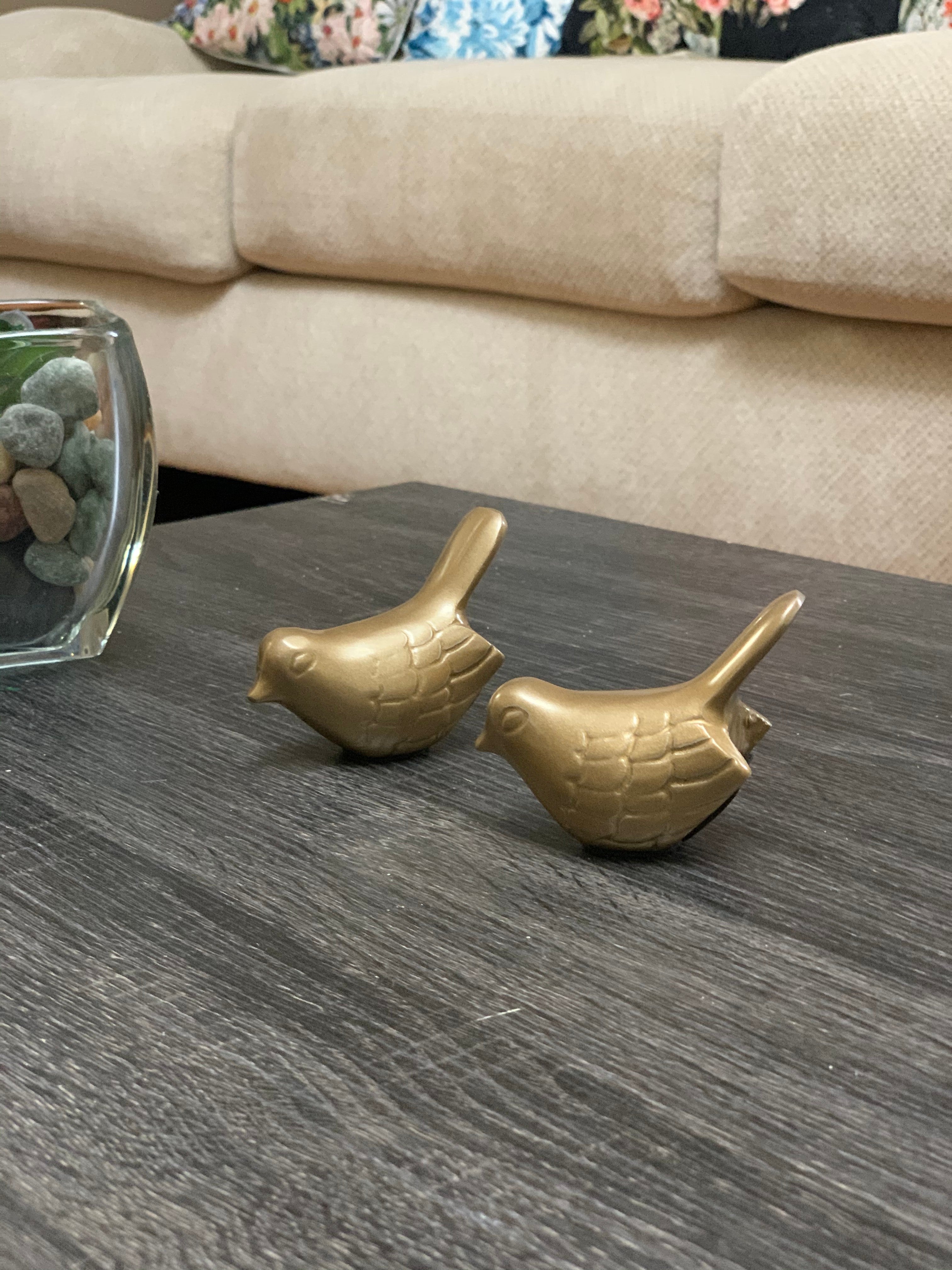 Two glossy marigold bird figurines, small size, displayed together