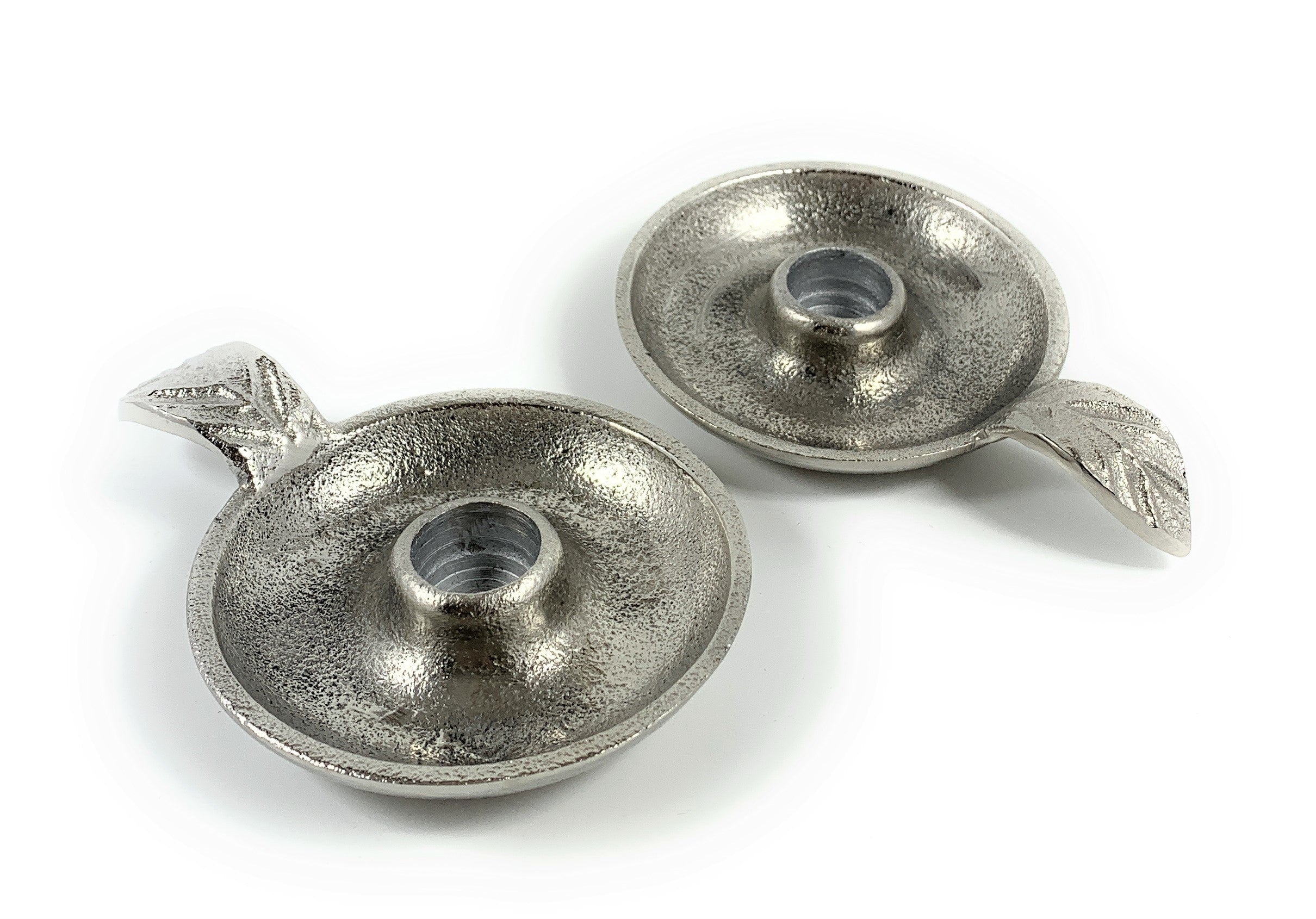 Set of two rustic silver aluminum taper candlestick holders with leaf-shaped handles