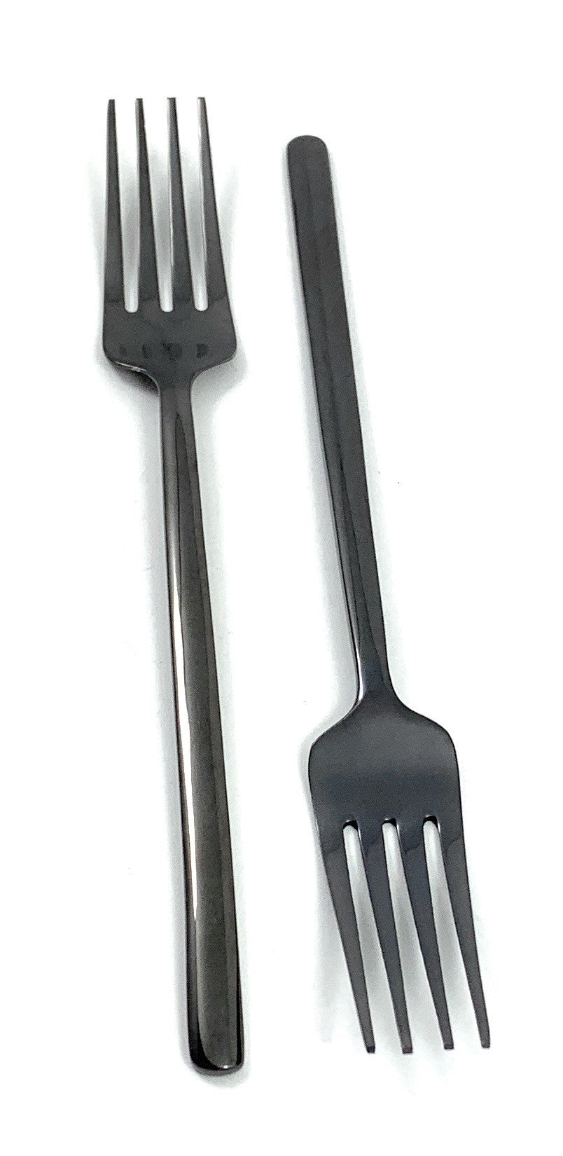 Set of six Vibhsa black stainless steel dinner forks arranged on a dark textured surface