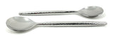 Two silver-colored spoons with textured, hammered handles and smooth, rounded bowls, laid parallel on a white background, one facing up and one down.