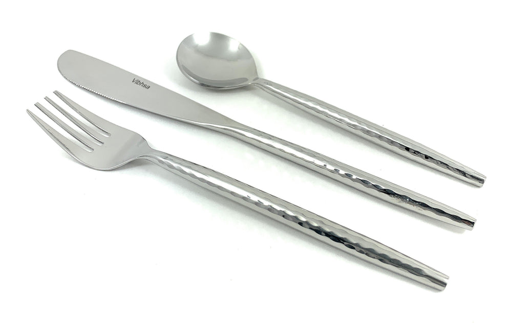 Hammered Stainless Steel Flatware 18-Piece Set with knives, forks, and spoons arranged on a tabletop