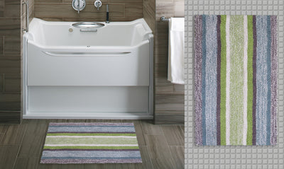 CHICOS HOME Multi Color Striped Bath Rug with blue, grey, and green stripes on a light floor