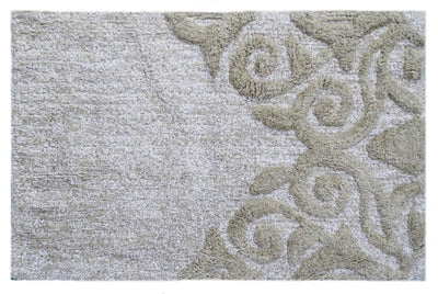 Beige and ivory rectangular bath rug with damask pattern