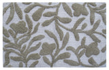 Beige and ivory damask patterned CHICOS HOME bath rug laid on floor