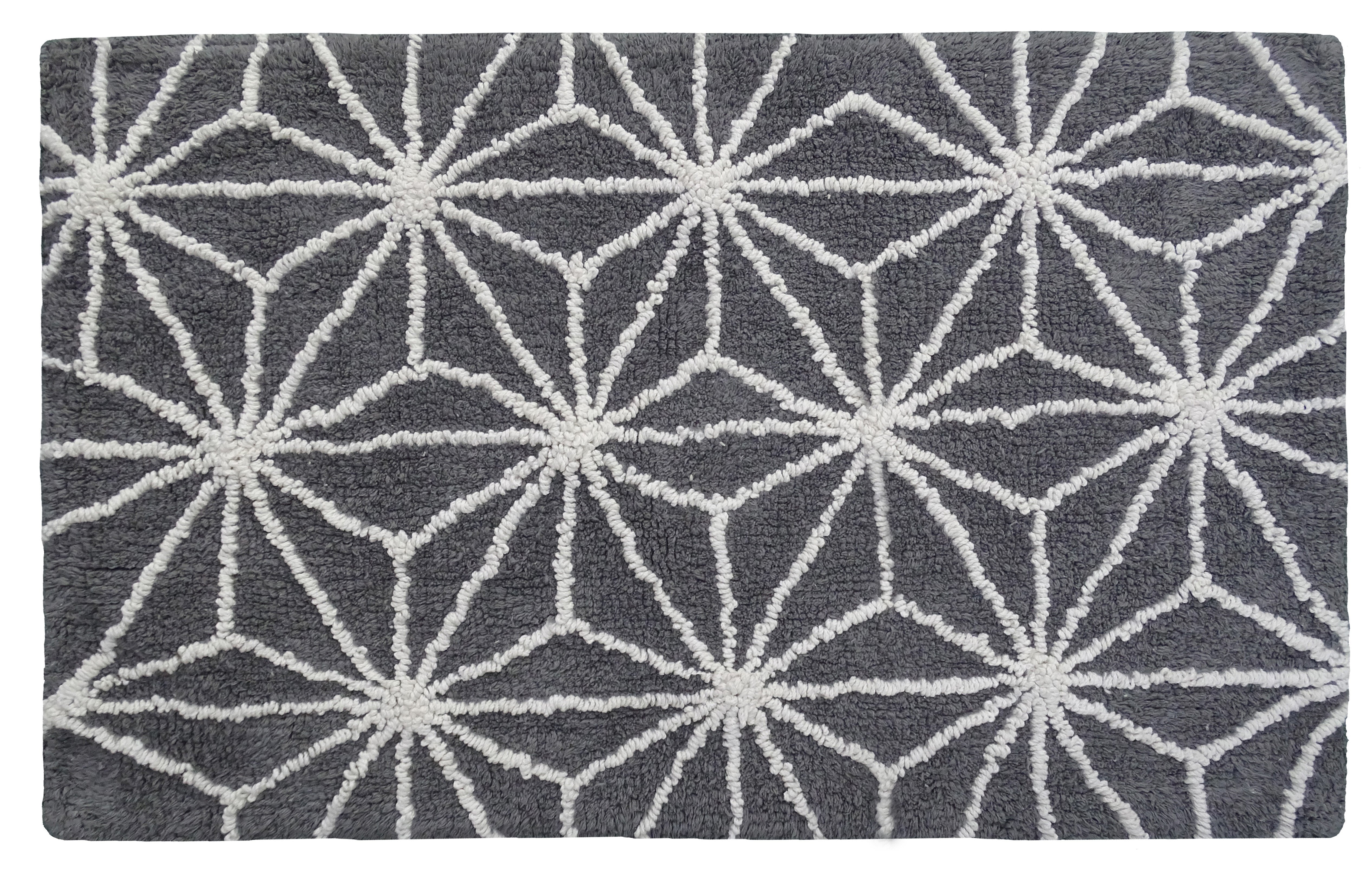 CHICOS HOME bath rug with geometric pattern in grey and ivory on bathroom floor