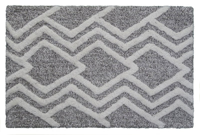 CHICOS HOME Bath Rug with geometric pattern in grey and ivory laid on a floor