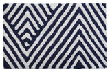 Bath rug with charcoal and ivory chevron pattern laid on bathroom floor near tub