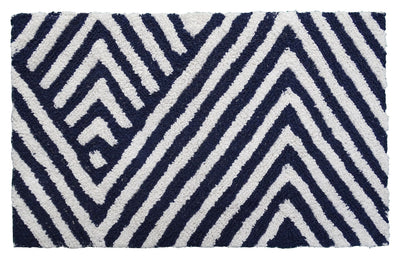 Bath rug with charcoal and ivory chevron pattern laid on bathroom floor near tub