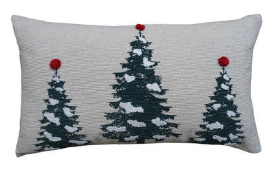 Christmas Throw Pillow with embroidered Christmas trees and pom pom detail on a couch