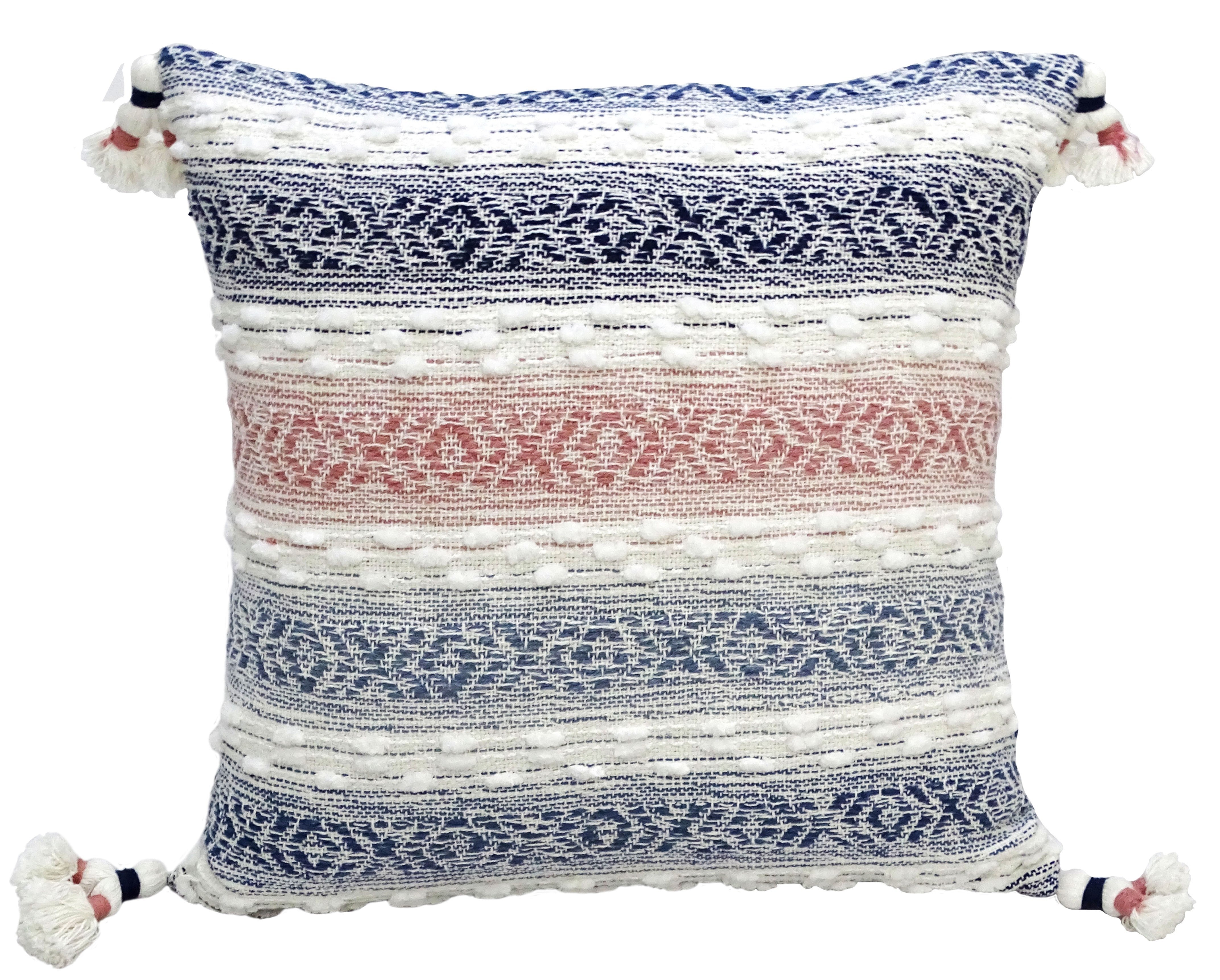 Multicolor textured woven throw pillow with tassels on sofa