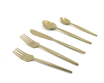 Vibhsa 20 Piece Golden Flatware Set displayed with forks, knives, and spoons on linen tablecloth