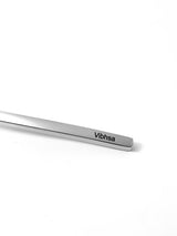 Close-up of a sleek, rectangular stainless steel dinner knife tip engraved with the brand name 'Vibhsa' on a white background.