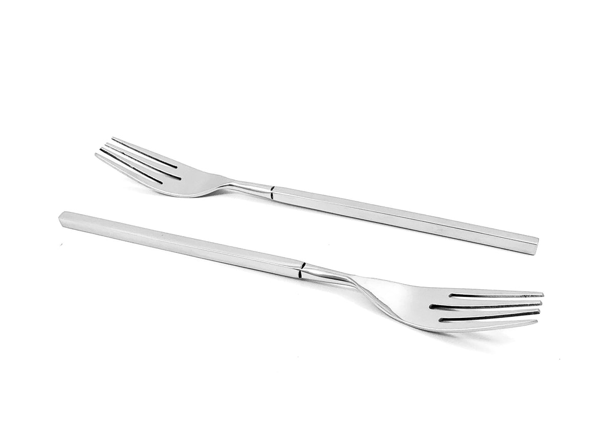 Two stainless steel salad forks with long, slender handles and four evenly spaced tines, shown on a white background.
