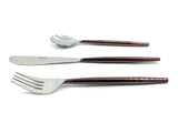 Set of three hammered stainless steel flatware pieces with reddish-brown textured handles including a spoon, knife, and fork, laid out on a white background.