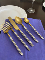 Golden Stainless Steel Flatware Set of 5 pieces with twisted handles displayed on a surface