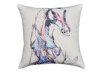 White decorative pillow 18x18 with black embroidered animal print, pom-poms, and tassels on a blue upholstered chair