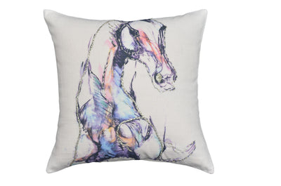 White decorative pillow 18x18 with black embroidered animal print, pom-poms, and tassels on a blue upholstered chair