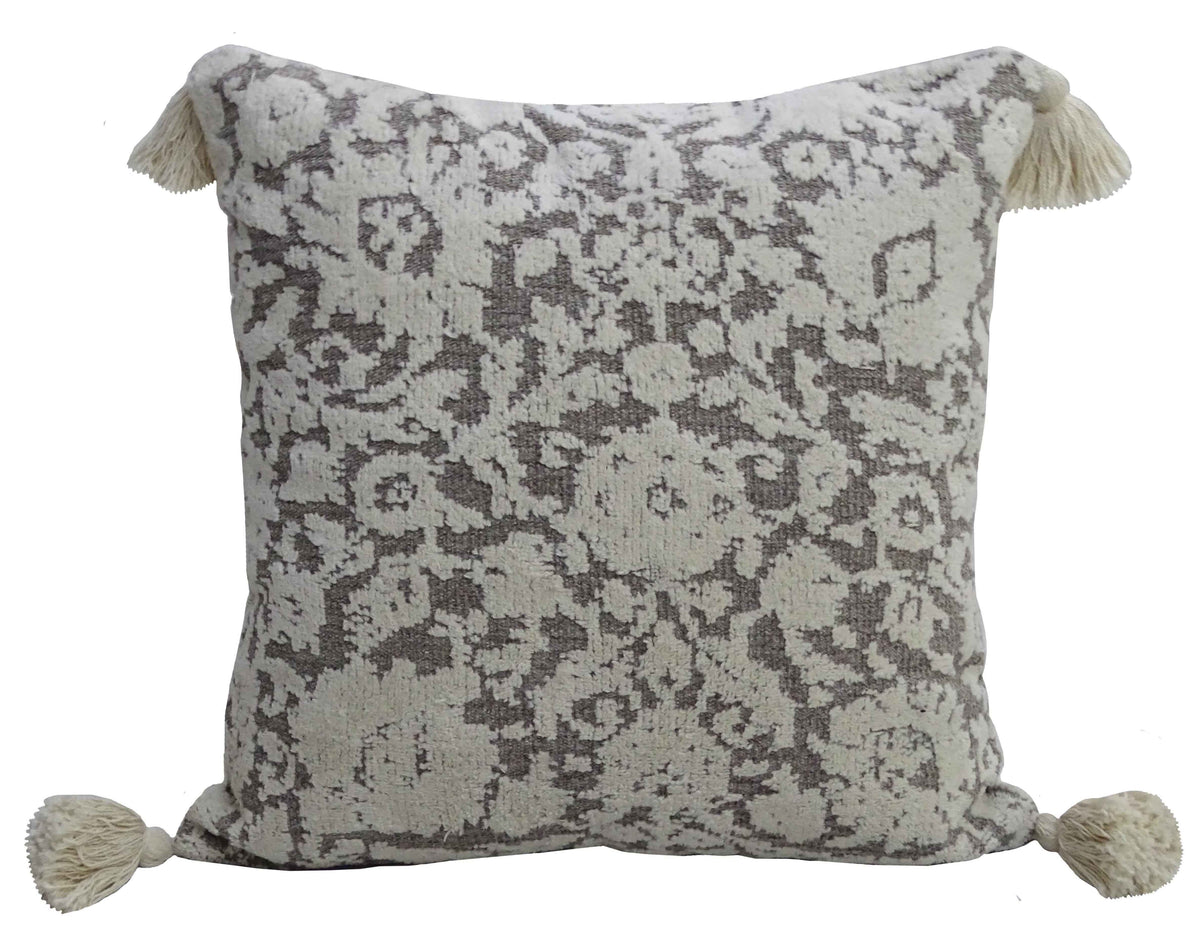 Square cream throw pillow featuring a brown damask pattern and cream-colored tassels on each corner