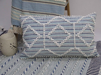 Modern handwoven colorful throw pillow 14x24 inches on a sofa