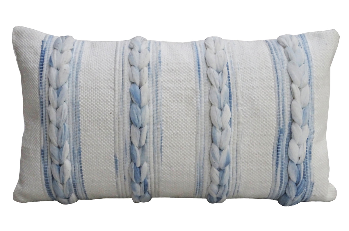 Rectangular handwoven throw pillow with soft white base and vertical braided stripes in pale blue and white, adding texture and subtle color contrast.