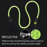 Green reflective nylon braided dog leash with black handle and metal clip, designed to enhance visibility in low light, shown on black background.