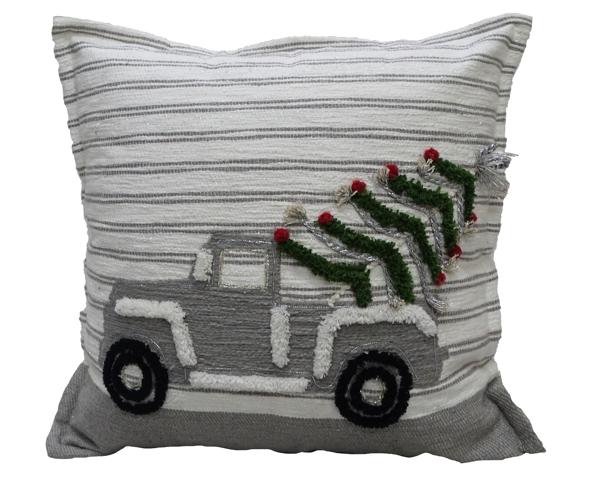 Square beige throw pillow with horizontal gray stripes, embroidered with a gray vintage truck carrying a green Christmas tree decorated with red pom-pom ornaments