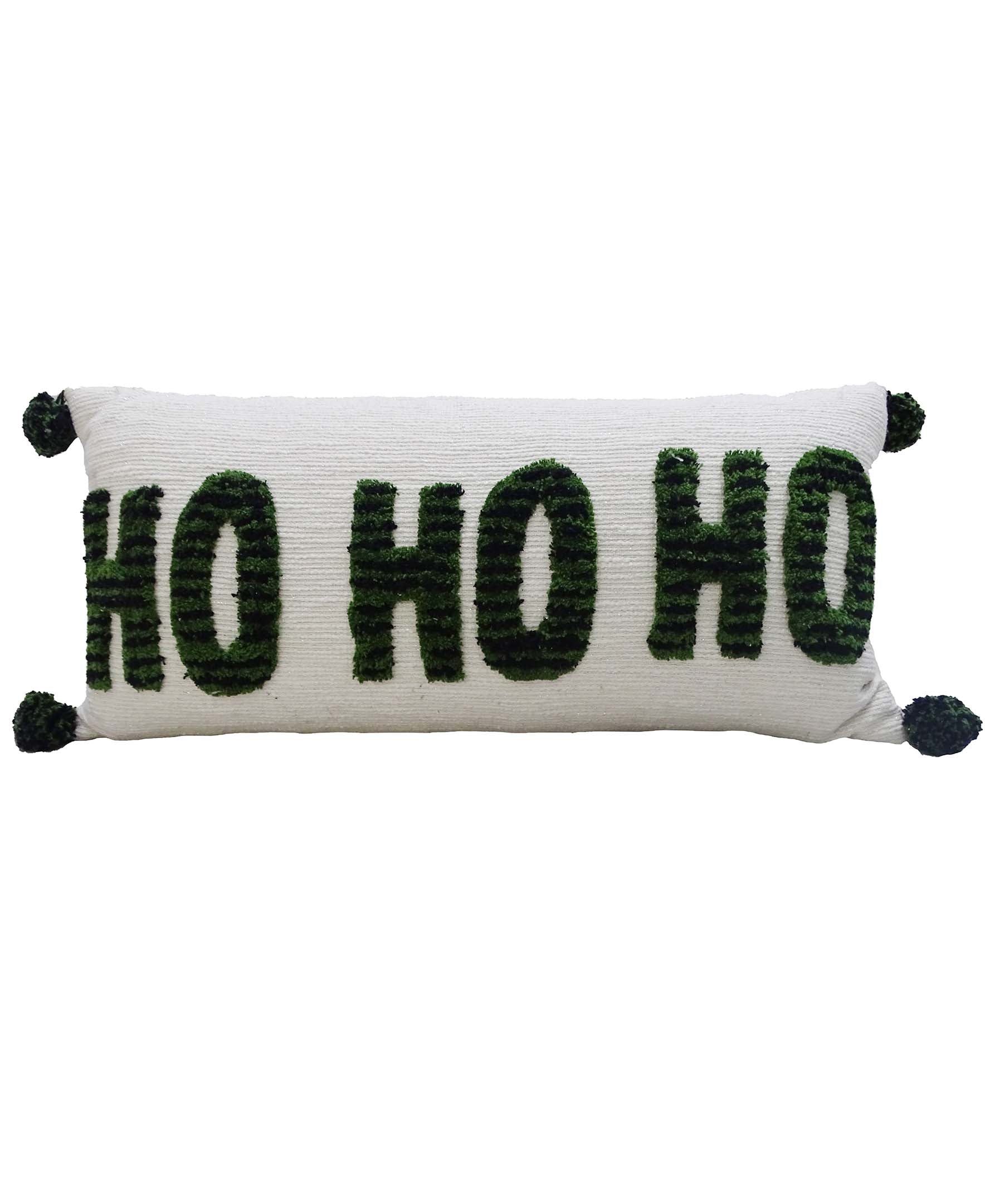 Vibhsa Christmas pillow with tufted HO HO HO embroidery and pom-poms on a couch