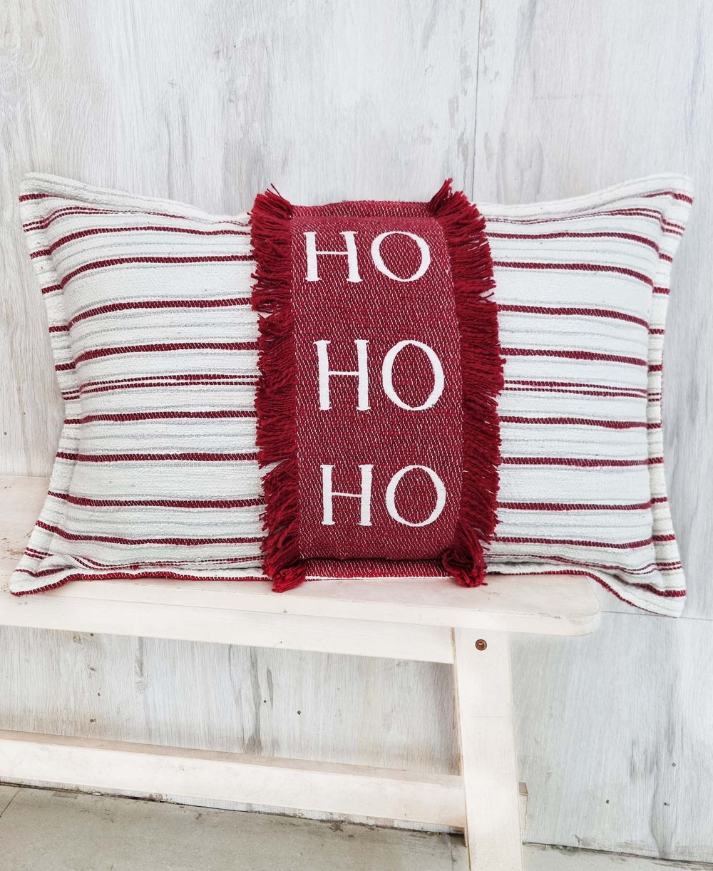 Vibhsa Christmas Throw Pillow embroidered with HoHoHo text on red cotton fabric