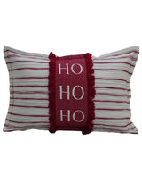 Rectangular white pillow with horizontal red stripes and a central red panel featuring white letters spelling 'HO HO HO' framed by red fringe.