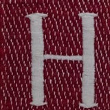 White embroidered letter 'H' on a textured deep red fabric with small white diagonal stitch patterns.