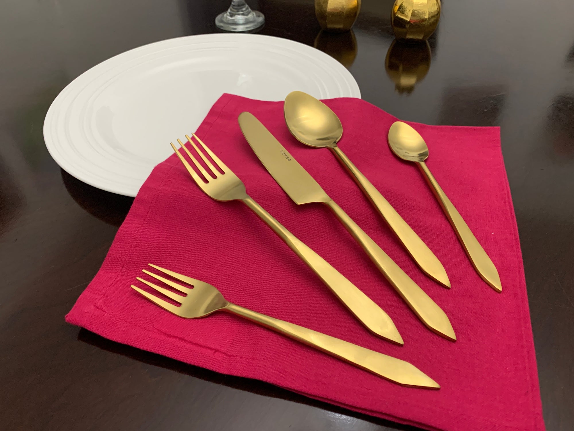Flatware set of 20 pieces featuring golden stainless steel utensils arranged neatly