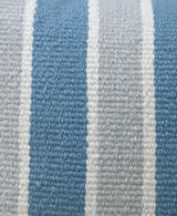 Close-up of a handwoven fabric with chunky yarns in blue, white, and gray stripes arranged vertically with a textured pattern.
