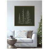 Framed minimalist canvas sketch of three white evergreen trees on dark green background above white sofa with patterned cushions and modern round wooden side table.