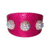 Wide fuchsia collar with a snake skin texture, adorned with three round clusters of custom iridescent Swarovski crystal rivets evenly spaced across its surface.