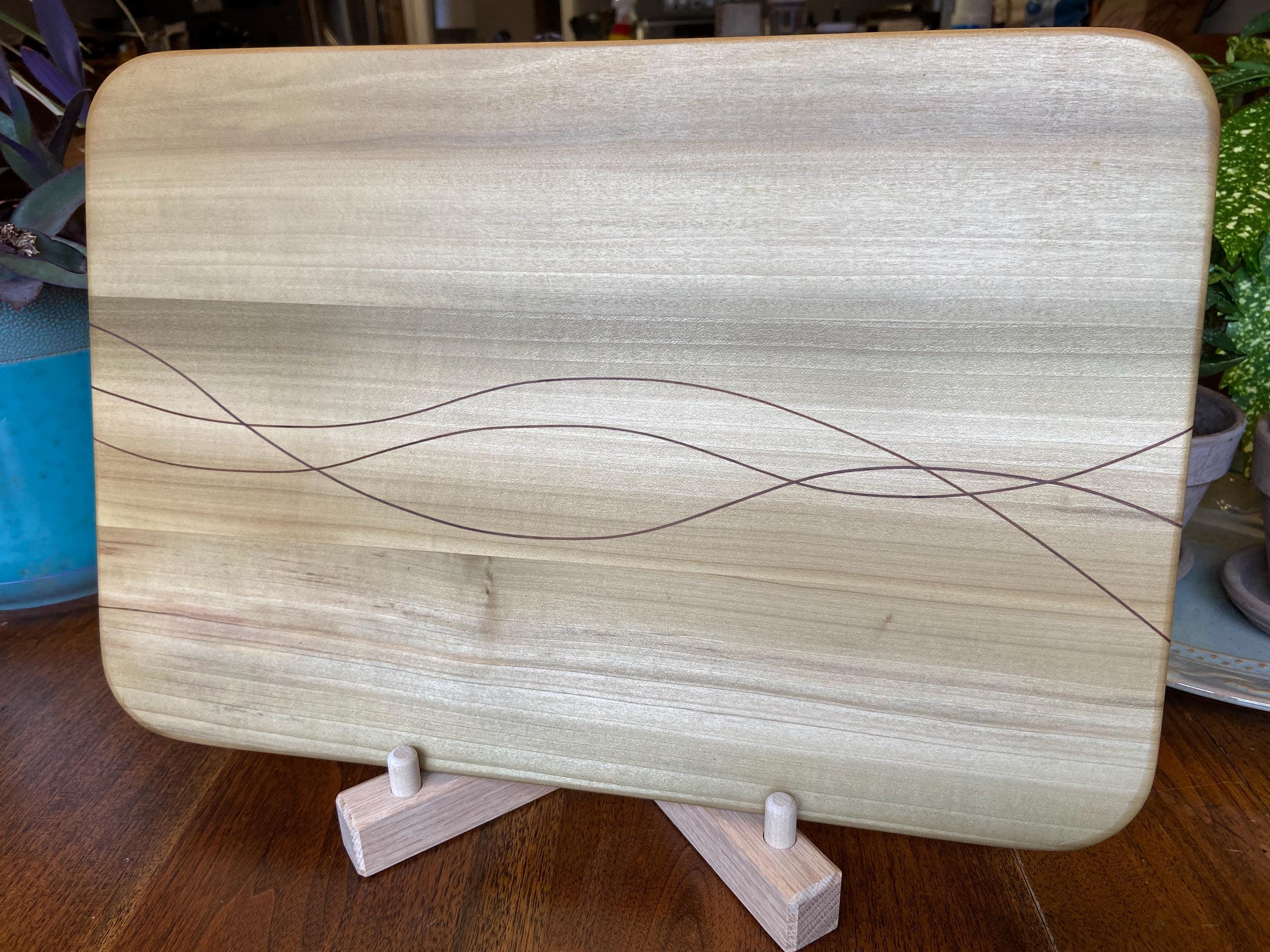 Handcrafted solid Poplar charcuterie board with Peruvian Walnut banding and inlay